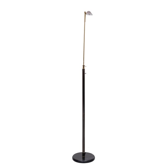 Very nice Halogen Floor lamp . Gun Metal Grey with Brass comes with a good working dimmer . Black Marble base . turn able...