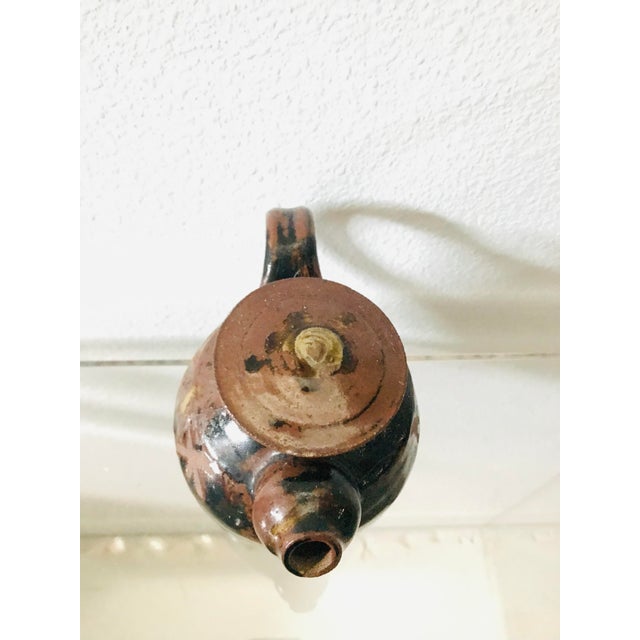 How funny are those little tiny feet? This quirky hand made piece appears to be signed on the side but we are not familiar...