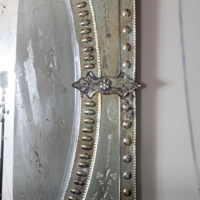 Etched and scalloped glass Venetian mirror.