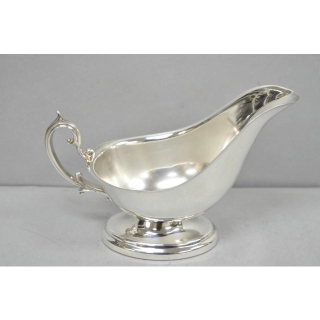 Vintage English Regency Style Silver Plated Gravy Sauce Boat with Handle. Circa Mid 20th Century. Measurements: 5" H x...