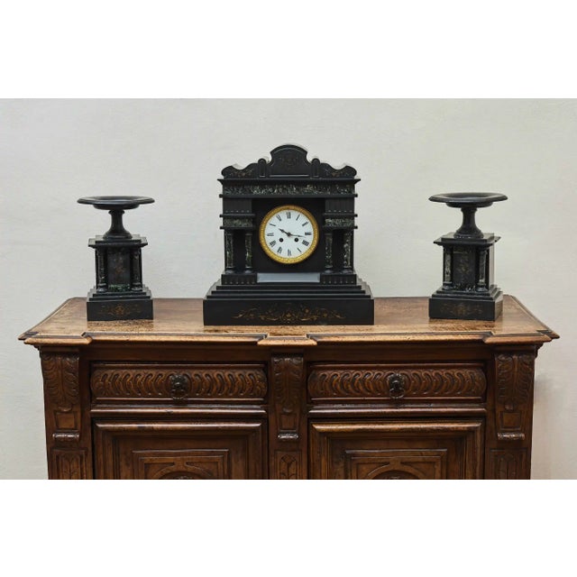 Representative antique mantel clock in elegant Art Deco style from the 1920s. This is an impressive three-piece mantel set...