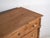 This antique chest of drawers in solid pine is a European storage piece from the early 20th century, originally designed...