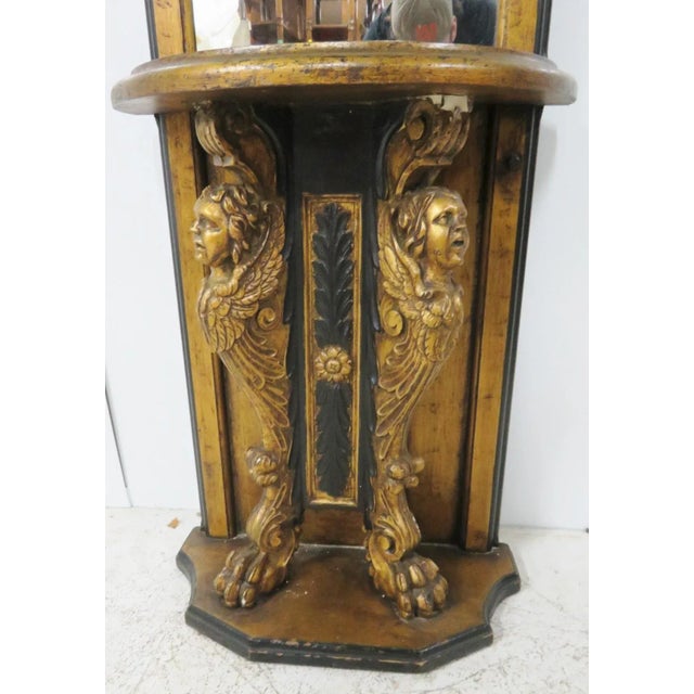 Hollywood Regency Pier mirror with figural carved base with claw feet , domed top with lights recessed in it.gold gilt and...