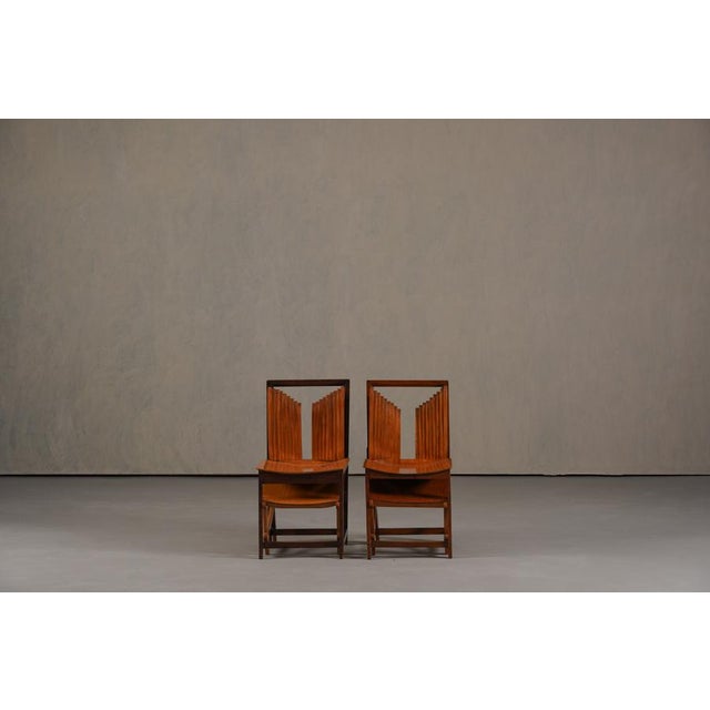 A unique set of two vintage dining chairs from France, dating to the 1960's. Sculptural and artistic in form, the design...