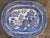 A generously scaled English ironstone serving platter featuring the classic blue and white willow pattern. The...