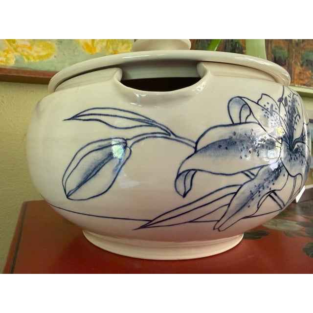 Beautiful blue and white handprinted ceramic glazed soup tureen with artists signature and lid. Holds liquid or solid food...