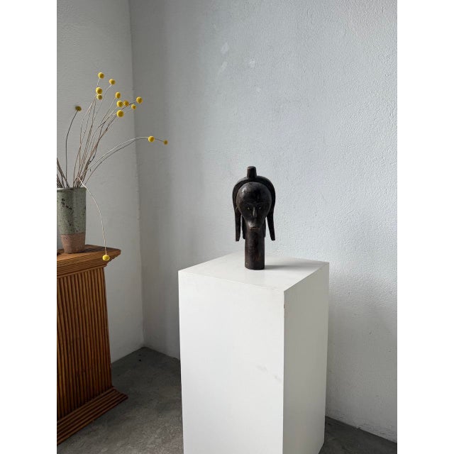 Antique African Fang reliquary head. Of Gabonese origin, this solid wood head features clean, feminine lines. The eyes are...