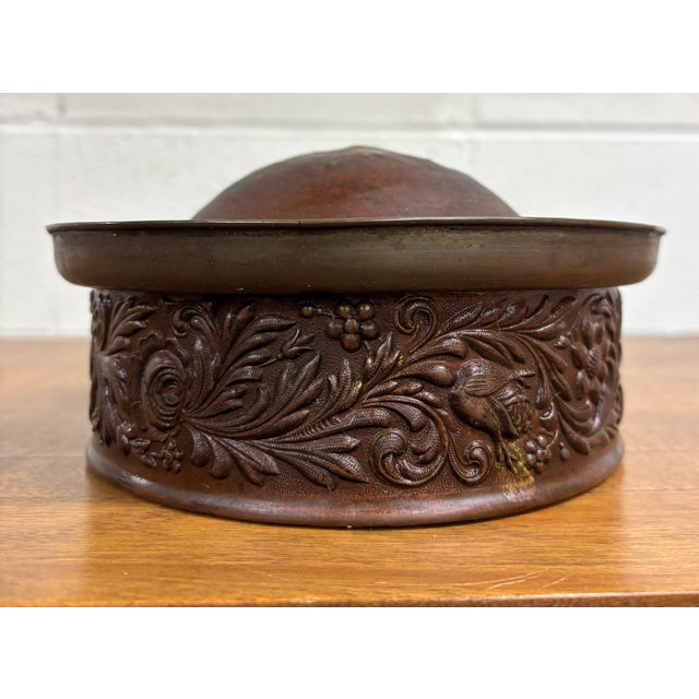 This is an antique embossed copper decorative vessel or warming pan component featuring richly detailed repoussé floral...