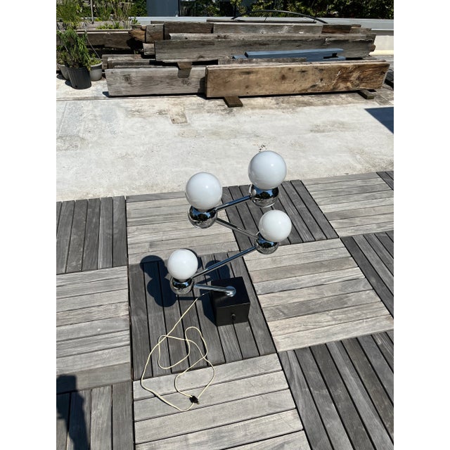 70’s four bulb chrome arms with black cube base Several switch settings to light some bulbs selectively