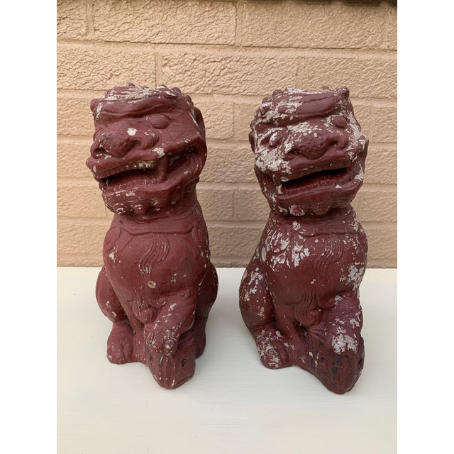 A stunning pair of antique Chinoiserie painted cast stone statues of Asian Foo Dogs. These would be a perfect accent in a...
