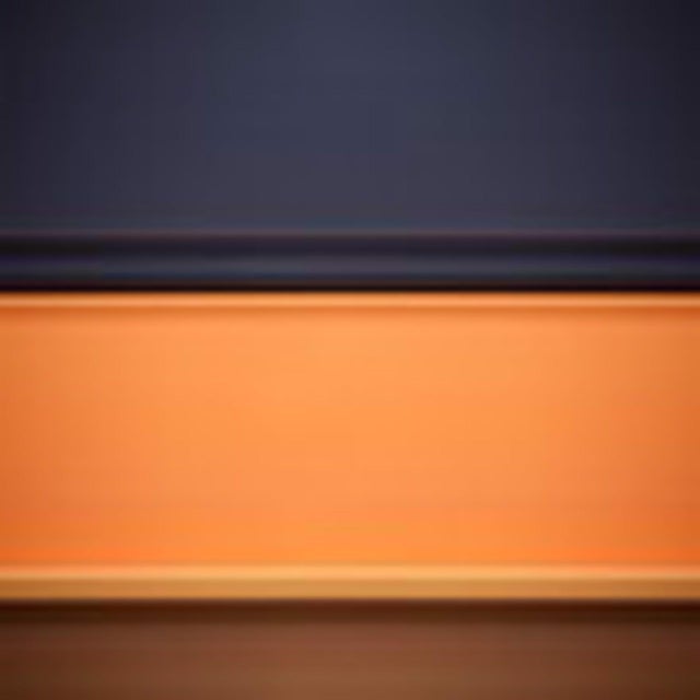 This artwork features a serene interplay of rich, dark hues contrasted against a vibrant orange band, evoking a sense of...