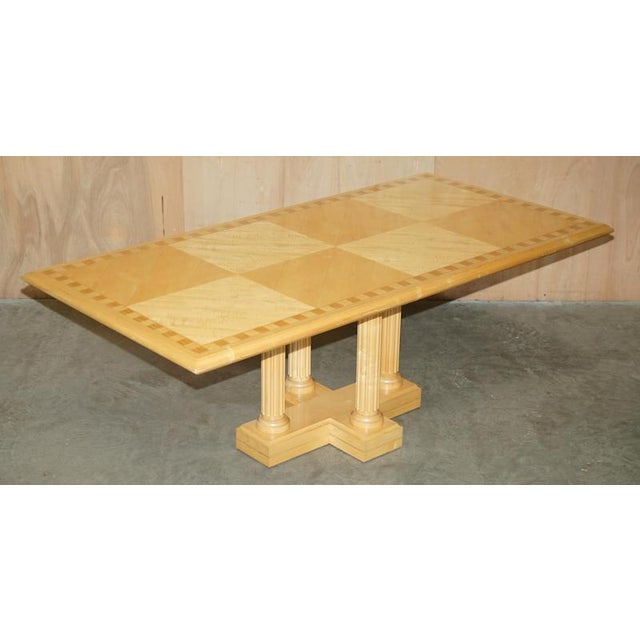 A very good looking and well-made table, it has a four Roman Corinthian pillared column base, the top is parquet and looks...