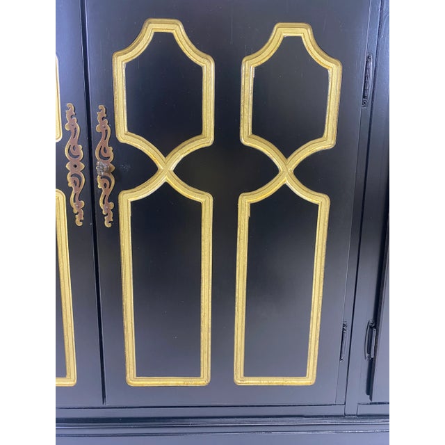 This is a black and gold Hollywood Regency and Lacquered Chest by Henredon and designed by Dorothy Draper in the...