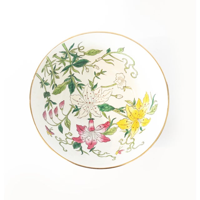 This charming vintage bowl features a whimsical and asymmetrical pattern of hand-painted botanical tiger lilies in vibrant...