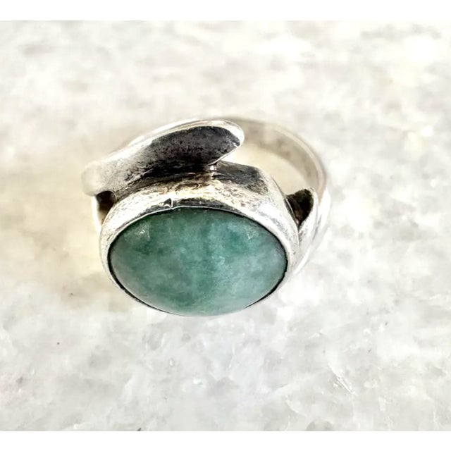 Lovely, contemporary aquamarine ring set in sterling silver. Beautiful color with subtly curved setting.