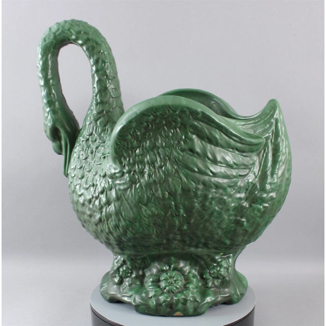An extraordinary and highly important exhibition-sized Weller Pottery swan planter jardiniere. This rare monumental piece...