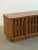 W53 D18 H25 Vintage Low profile credenza with nice sculptural details in the front. Item has been refinished in a light,...