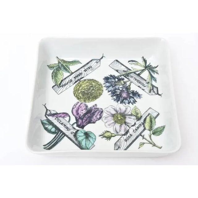 This wonderful substantial sized porcelain mid century modern Piero Fornasetti bowl or serving piece has all the elements...
