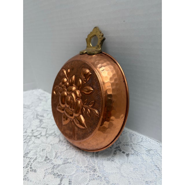 Vintage copper and brass jello mold with textured rose pattern. Perfect as a wall accent. Hammered copper and golden brass...