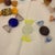Offered here is a set of ten glass candies.