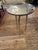 Eye catching sophisticated modern chrome end table having shiny slightly aged round top and elegant tripod tapered...