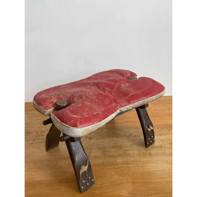 Bring a touch of Mid-Century global style to your home with this authentic Egyptian camel saddle stool. This iconic piece...
