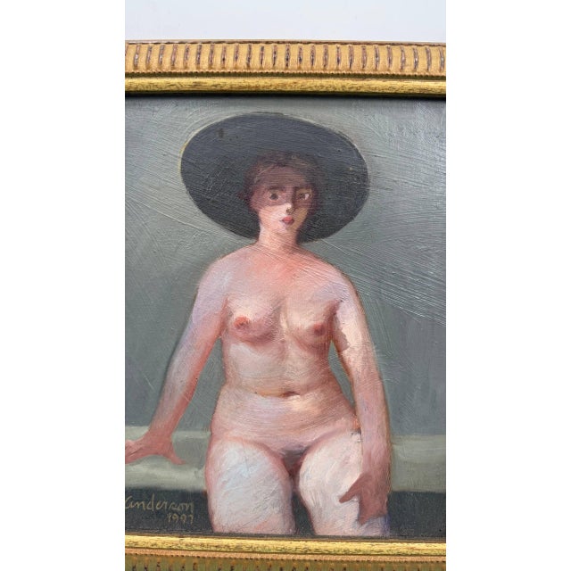 Signed figurative female nude portrait dated 1997, depicting a seated woman wearing a dramatic black wide-brimmed hat....