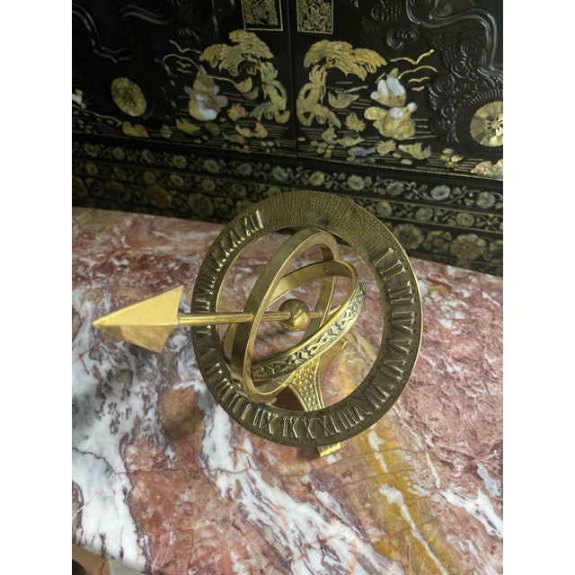 Bring timeless sophistication to your interior with this beautifully crafted vintage solid brass armillary sphere, a...