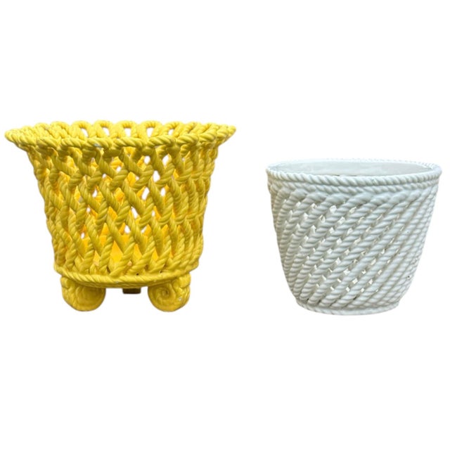Pair of vintage ceramic pots with woven looks. Larger yellow pot with a round open basket weave design, flared mouth, and...