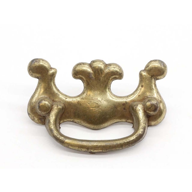 Traditional brass vintage bail drawer pulls with a fixed handle. Mounting screws are included. Priced as a pair. The...