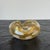 Mid-Century Mouth Blown Murano Trinket Bowl in Gold with White Polka Dots Measures approx: 5.5W x 4.5D x 2H Please visit...