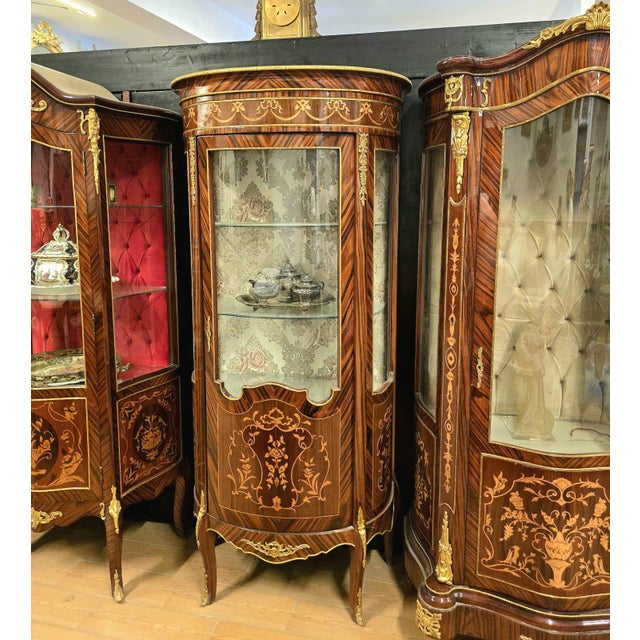 Make a statement with this grand French Louis XV-style display cabinet, crafted from solid, heavy wood and richly...