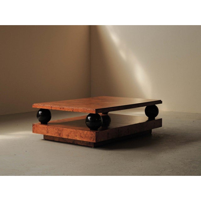 Impressive rectangular coffee table features a bold geometric composition, resting on a box-form base and a detached top...