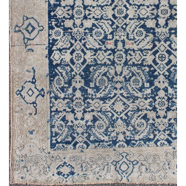 All-over blue geometric Herati design Persian Antique Malayer distressed rug in navy blue and earthy tones. Antique...