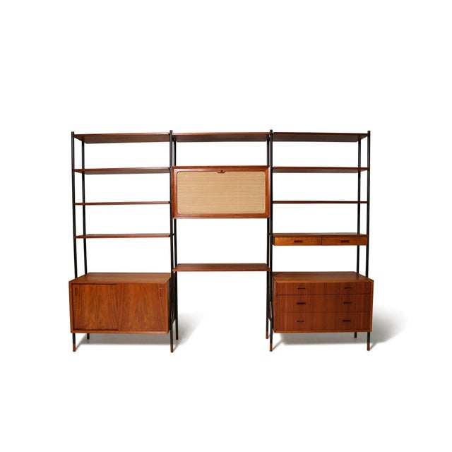 Impressive Danish Modern modular wall unit by Lyby Møbelfabrik, Denmark, circa 1960. Finely crafted with richly grained...