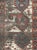 An antique Caucasian Kazak carpet with a weathered and distressed appeal from the turn of the 20th century. This shabby...