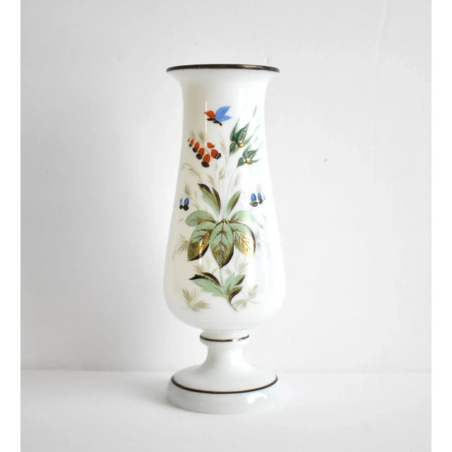 An antique, late 19th to early 20th-century hand-blown white opaline or Bristol glass vase, hand-painted with leaves,...