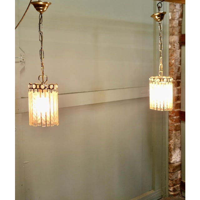 Pair of French Art Deco Etched Glass Ceiling Pendants These lovely lights are round they have flat peach glass pendants...