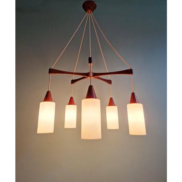 Large Scandinavian teak chandelier with five arms and white satin opaline shades, 1960s. Compatible with E14 LED bulbs....