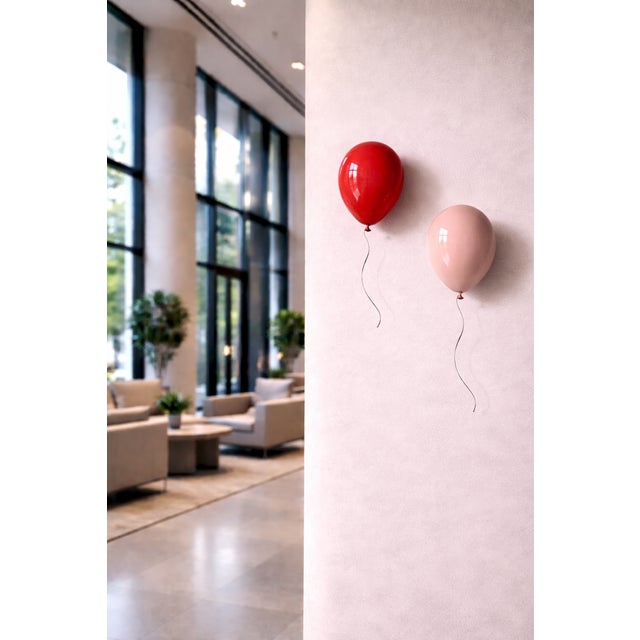 Add a unique sense of individuality into your space with this ceramic light pink balloon wall sculpture. Handcrafted from...