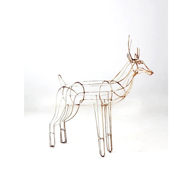 This mid-century iron wire reindeer features a sculptural form with sweeping lines and an open wire design that creates a...