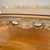 1940s French Provincial Style Kidney-Shaped 5 Leg Coffee Table With Inlaid Marquetry Top and Glass Overlay For Sale - Image 4 of 18