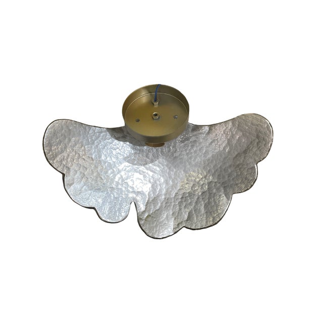 A pair of elegant wall sconces in a golden hue that radiates a spectacular, golden shine. Their structure, inspired by the...
