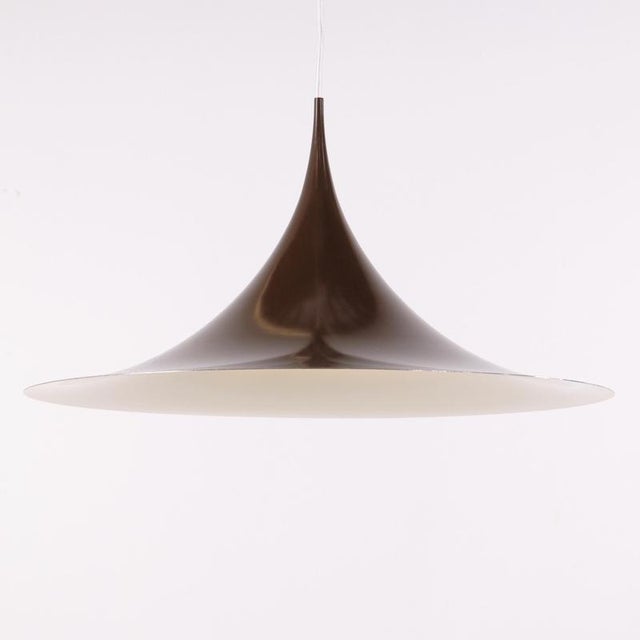 Semi pendant designed by claus bonderup & torsten thorup for fog & mørup. The lamp is an original fog & mørup model with a...