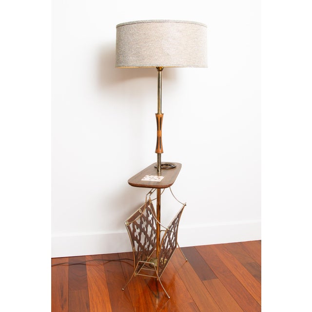 Unique mid century floor lamp with iconic style. Combines a floor lamp, side table, magazine rack and ashtray PLUS its own...