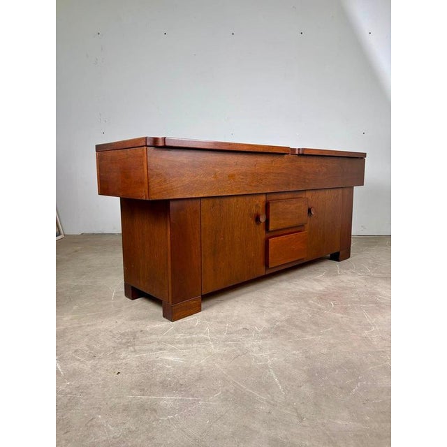 An elegant vintage sideboard designed by Giovanni Michelucci and manufactured by Bernini in Italy during the 1960s. The...