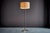 Floor Lamp in Brass and Wood by Kalmar, featuring a refined brass construction with a timeless mid-century modern design....
