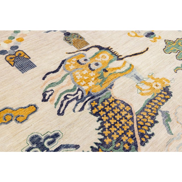 This Modern Chinese-style wool rug reinterprets classic Qing Dynasty motifs for today’s home. Featuring a soaring dragon...
