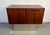 A striking Mid-Century Danish credenza crafted from richly figured rosewood and accented with a sleek chrome base. This...