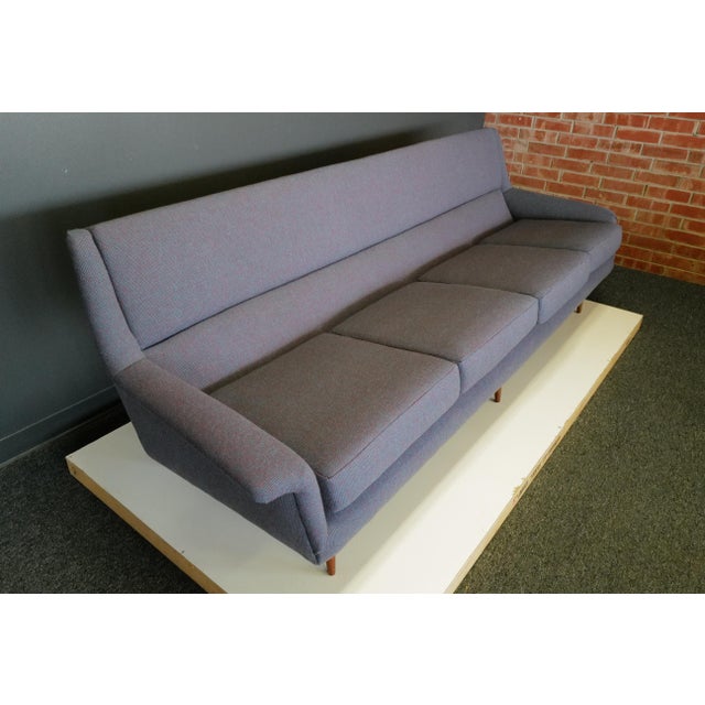 Milo Baughman's tapered leg sofa, adorned with a fresh Herman Miller, Alexander Girard fabric and new foam, exudes...